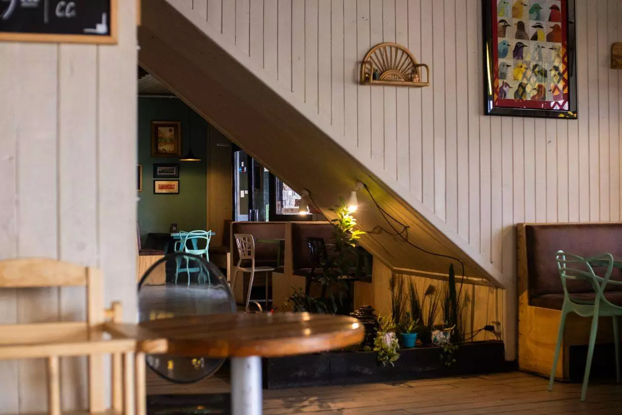 Wooden cafe interior representing Mandalay's growing lifestyle and retail culture tied to the 2026 Blind Box trend