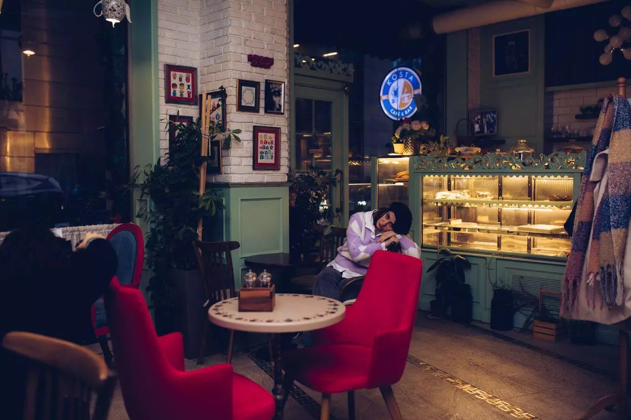 Cozy modern cafe interior representing the trendy lifestyle spots linked to the Blind Box collection craze in Mandalay 2026