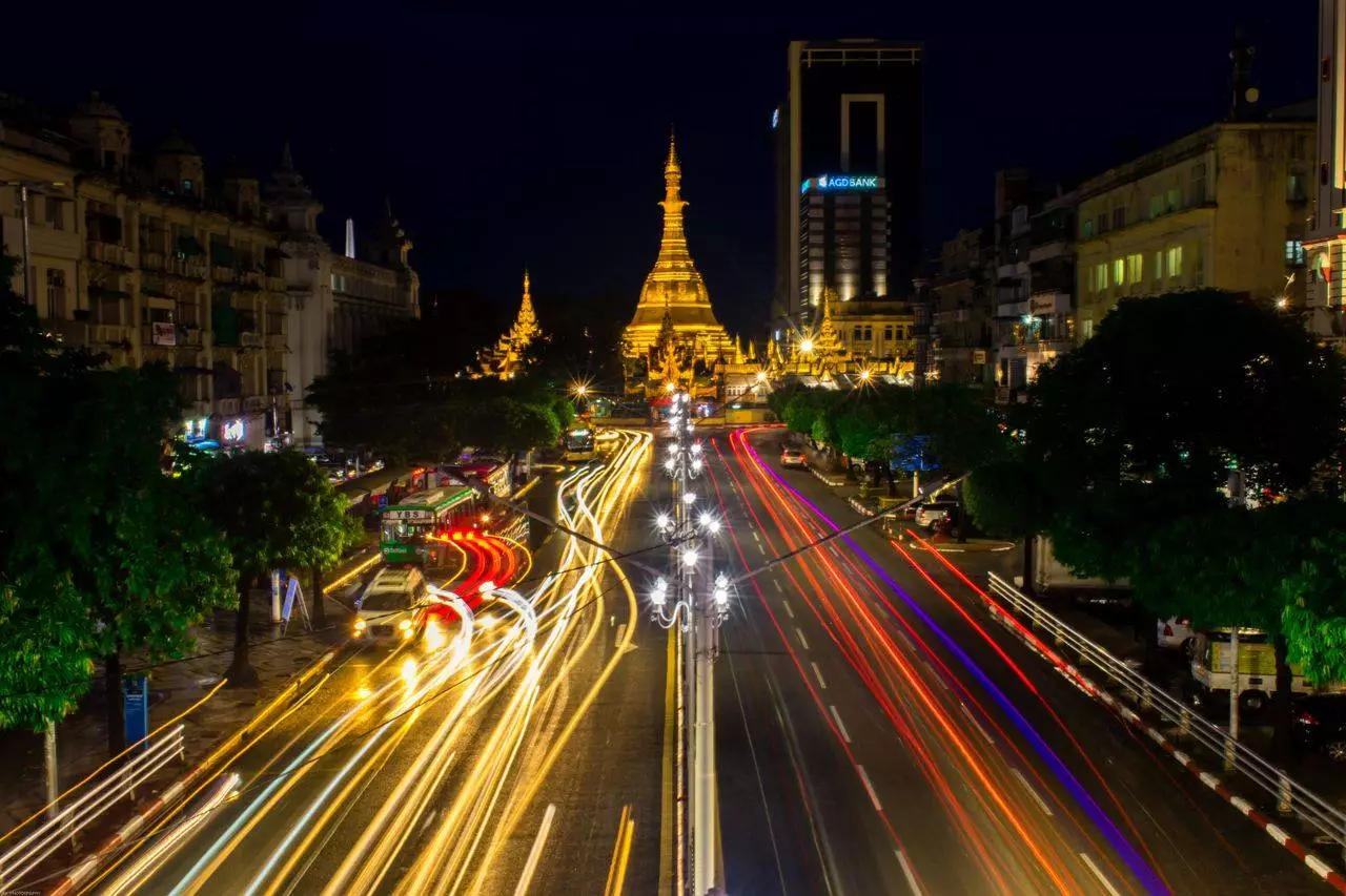 Illuminated pagoda with traffic at night representing the magical atmosphere of Mandalay's night markets and city life in 2026