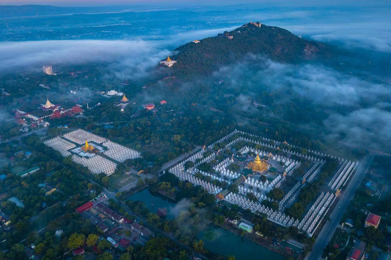 Aerial view of Mandalay's ancient temples and city landscape representing a comprehensive Mandalay travel guide for 2026